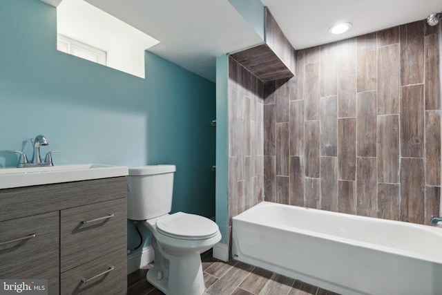 full bathroom featuring vanity, bathing tub / shower combination, and toilet