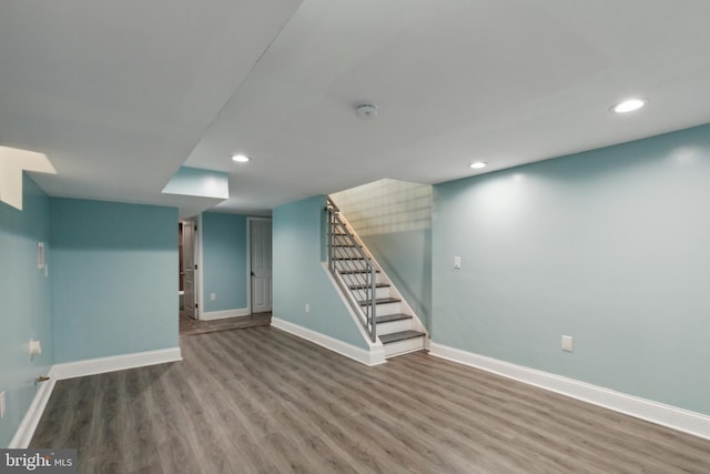 basement featuring hardwood / wood-style flooring