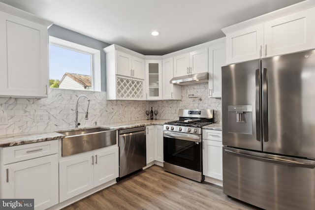 kitchen with white cabinetry, sink, and stainless steel appliances