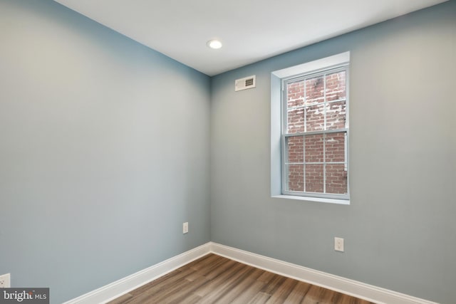 spare room featuring hardwood / wood-style floors