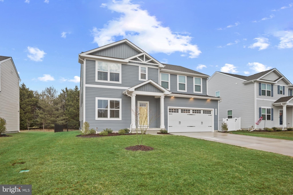 view of front facade with a garage and a front yard