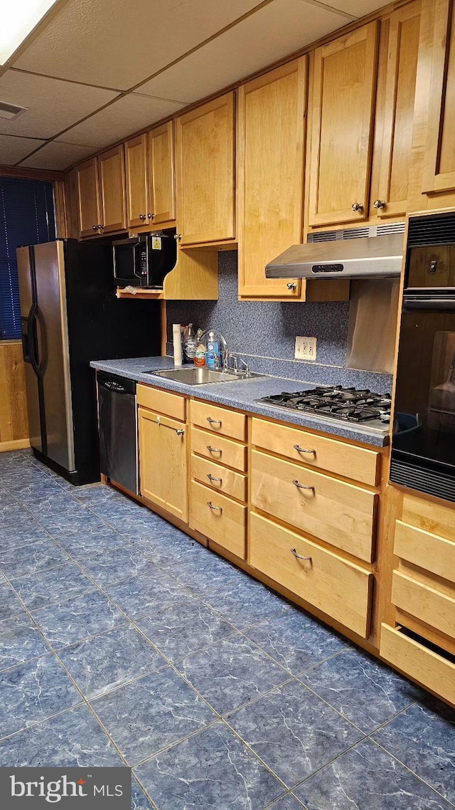 kitchen featuring tasteful backsplash, sink, a drop ceiling, and black appliances