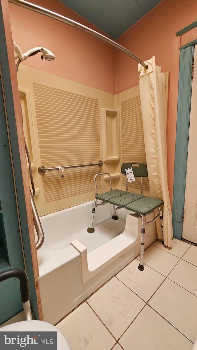 bathroom with tile patterned flooring and a shower with curtain