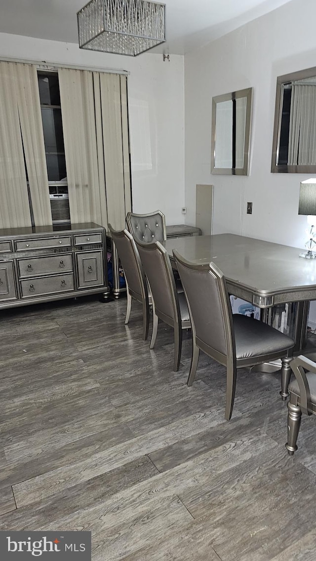 dining area with dark wood-type flooring