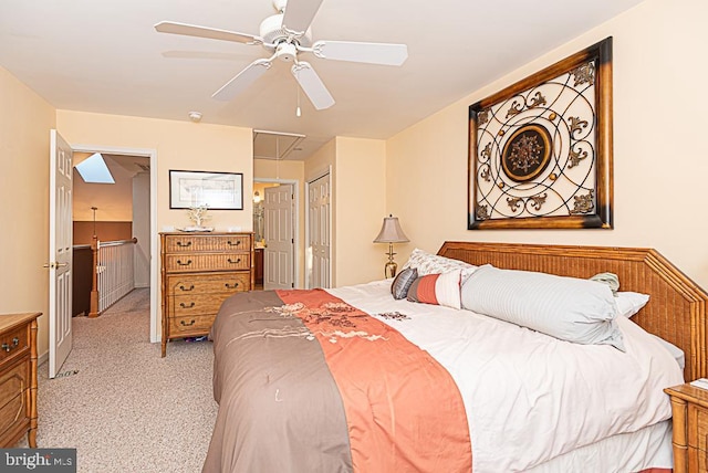 carpeted bedroom with a closet and ceiling fan