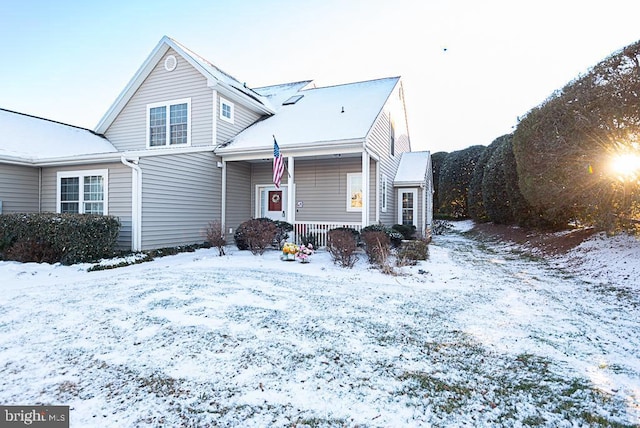 view of property featuring covered porch