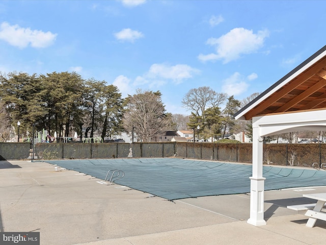 view of pool featuring a fenced in pool, a patio area, and fence