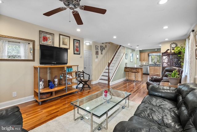 living room with hardwood / wood-style flooring and a healthy amount of sunlight