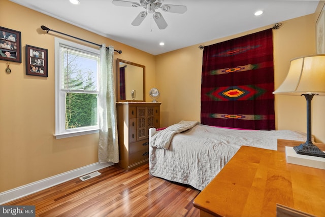 bedroom featuring ceiling fan and wood-type flooring