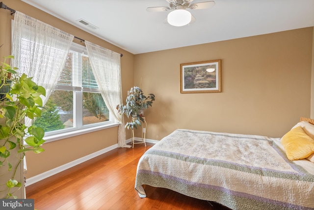 bedroom with hardwood / wood-style flooring