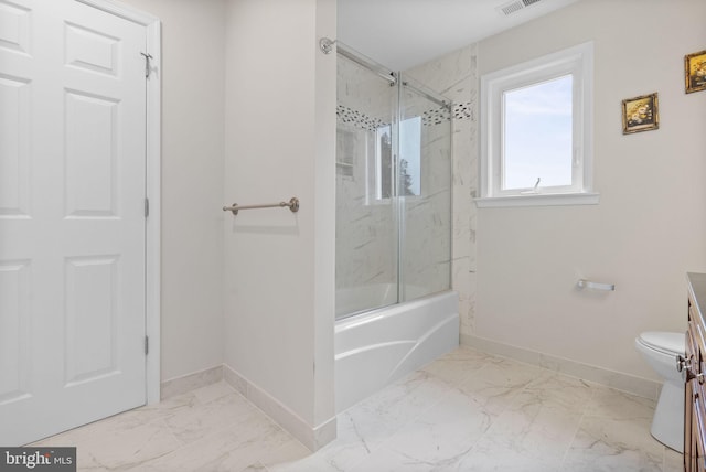 full bathroom with vanity, bath / shower combo with glass door, and toilet