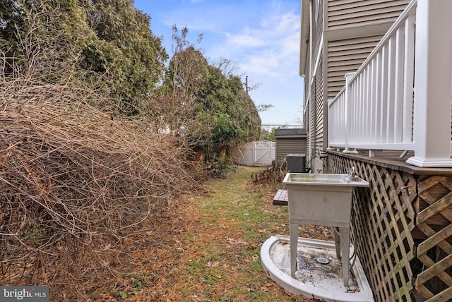 view of yard featuring central air condition unit