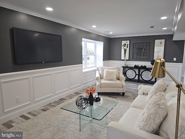 living room featuring crown molding and hardwood / wood-style floors