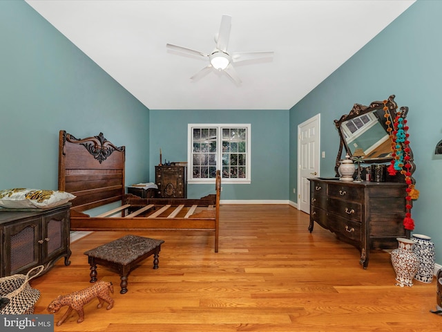 living area with ceiling fan and light hardwood / wood-style flooring