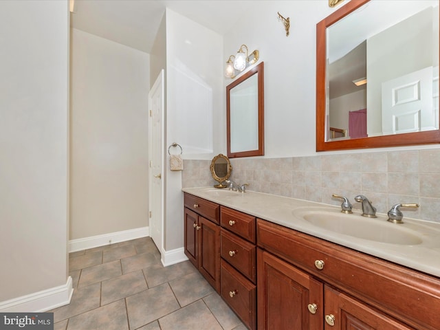 bathroom featuring vanity, tile patterned flooring, and decorative backsplash