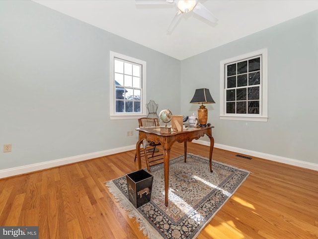 office area with ceiling fan and wood-type flooring