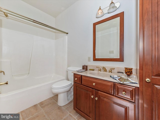 full bathroom featuring vanity, tile patterned floors, toilet, and washtub / shower combination