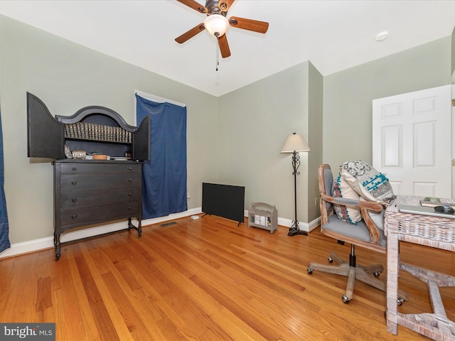 office area featuring hardwood / wood-style floors and ceiling fan