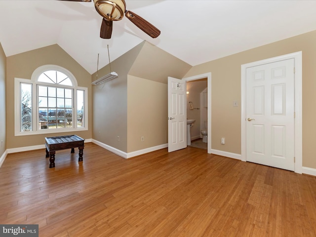 rec room with hardwood / wood-style flooring, ceiling fan, and lofted ceiling