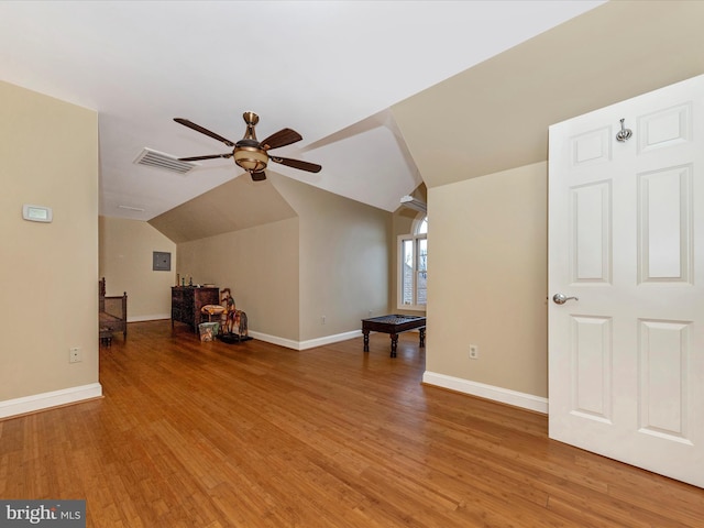 additional living space featuring vaulted ceiling, wood-type flooring, and ceiling fan