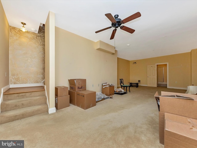 carpeted living room featuring ceiling fan