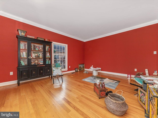 misc room with hardwood / wood-style flooring and ornamental molding