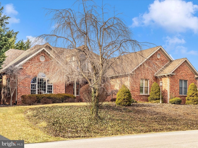 front facade with a front lawn