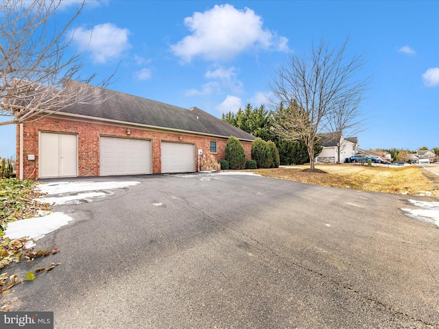 view of side of home with a garage