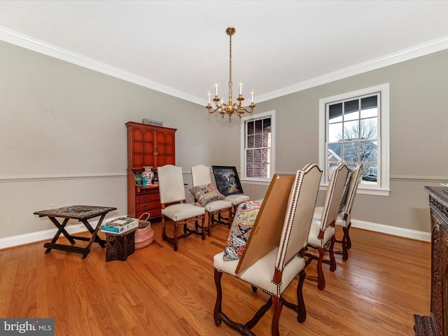 sitting room featuring ornamental molding, a chandelier, and light hardwood / wood-style floors