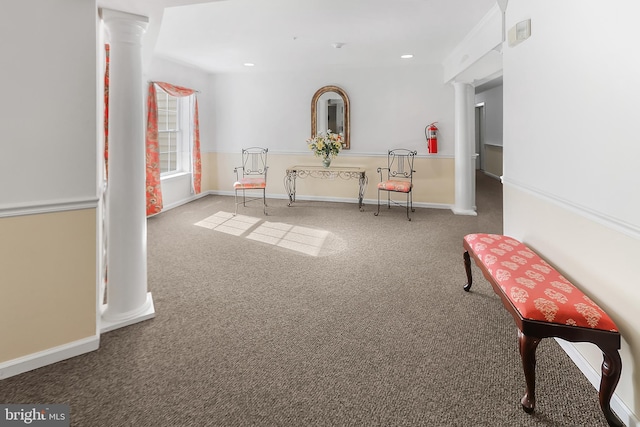 interior space with carpet flooring and ornate columns