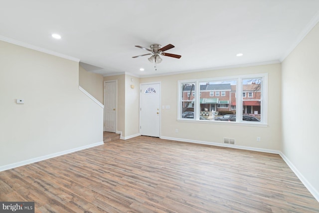 unfurnished living room with ornamental molding, light hardwood / wood-style floors, and ceiling fan