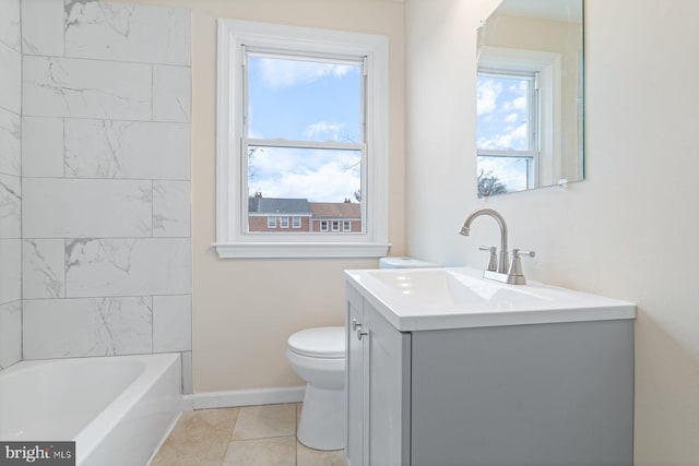 bathroom featuring tile patterned flooring, vanity, and toilet