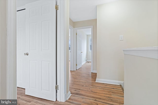 corridor featuring light hardwood / wood-style floors