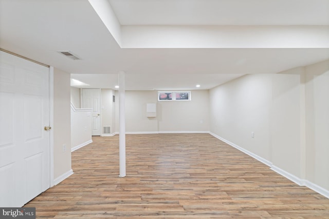 basement featuring light hardwood / wood-style floors