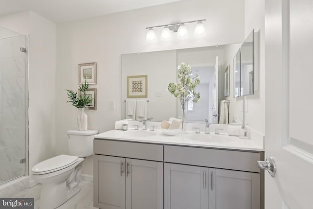 bathroom featuring vanity, toilet, and walk in shower