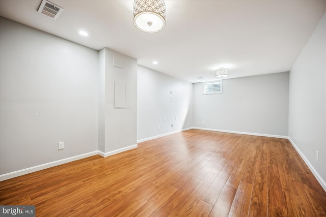 basement featuring recessed lighting, baseboards, visible vents, and light wood finished floors