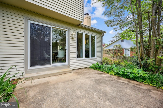 view of patio featuring fence