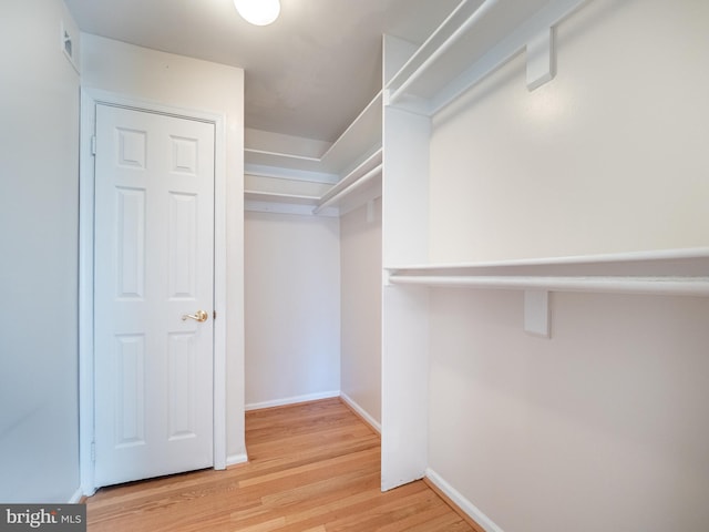 walk in closet featuring hardwood / wood-style floors