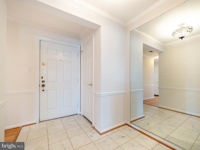 entryway featuring ornamental molding