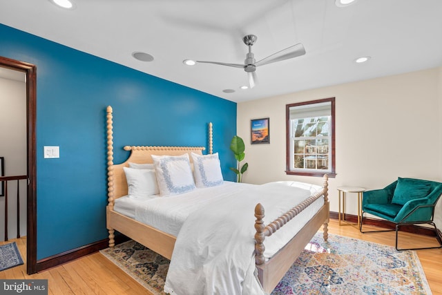 bedroom featuring ceiling fan and light hardwood / wood-style floors