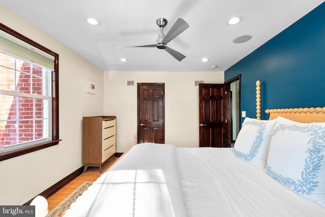 bedroom featuring ceiling fan and light wood-type flooring