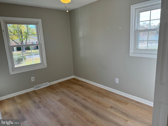 empty room with light hardwood / wood-style floors