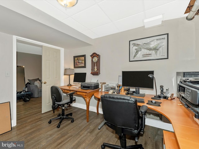 office area featuring wood-type flooring and a paneled ceiling