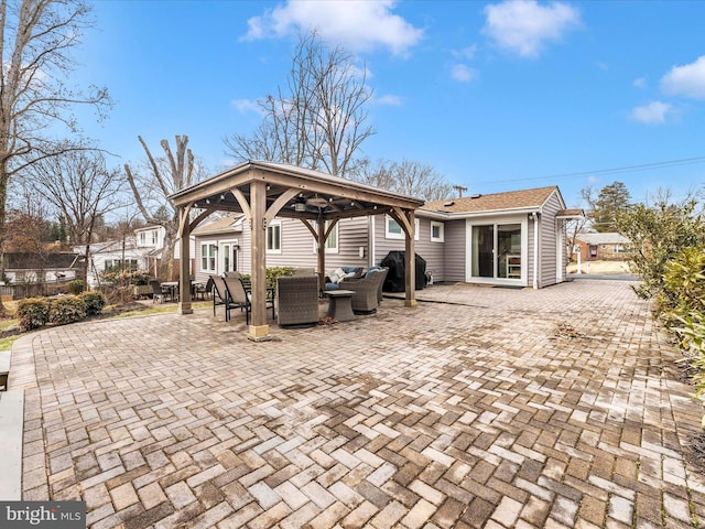 view of patio featuring an outdoor living space, a gazebo, and area for grilling