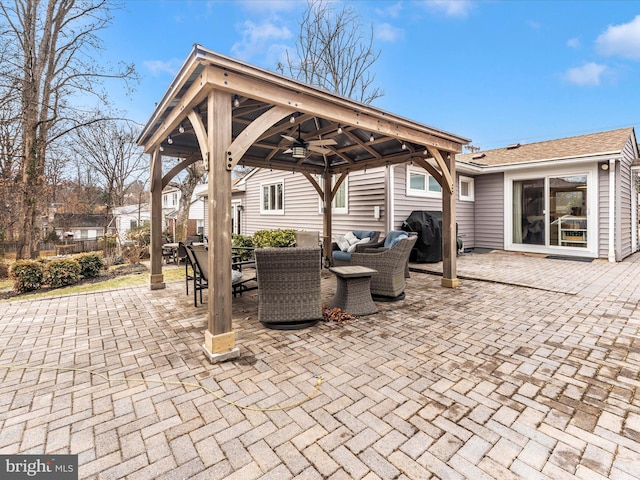 view of patio / terrace with a gazebo, ceiling fan, grilling area, and outdoor lounge area