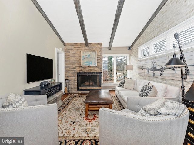 living room with beamed ceiling and a fireplace