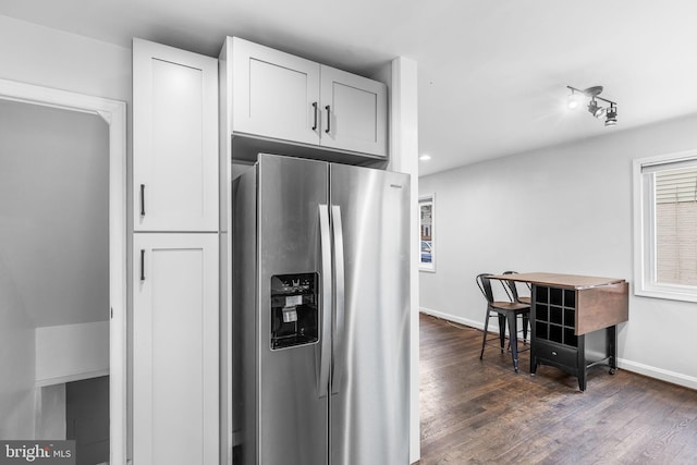 kitchen featuring dark hardwood / wood-style flooring, stainless steel fridge with ice dispenser, and white cabinets