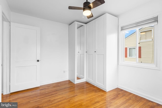 unfurnished bedroom featuring ceiling fan and light hardwood / wood-style floors