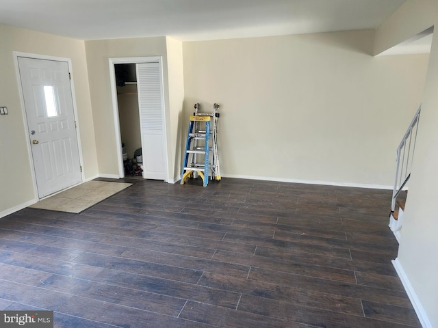 foyer entrance with dark hardwood / wood-style flooring