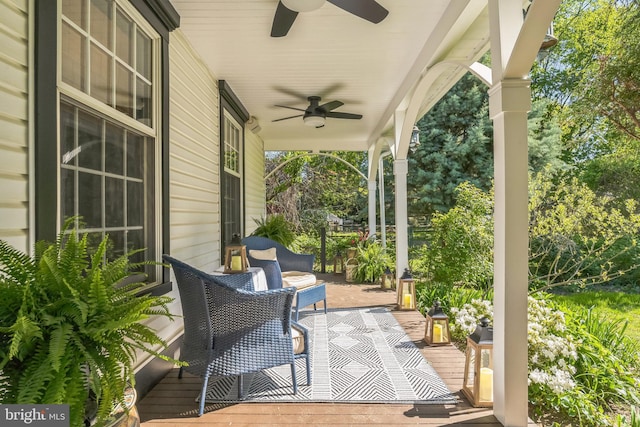 view of patio with ceiling fan and a porch